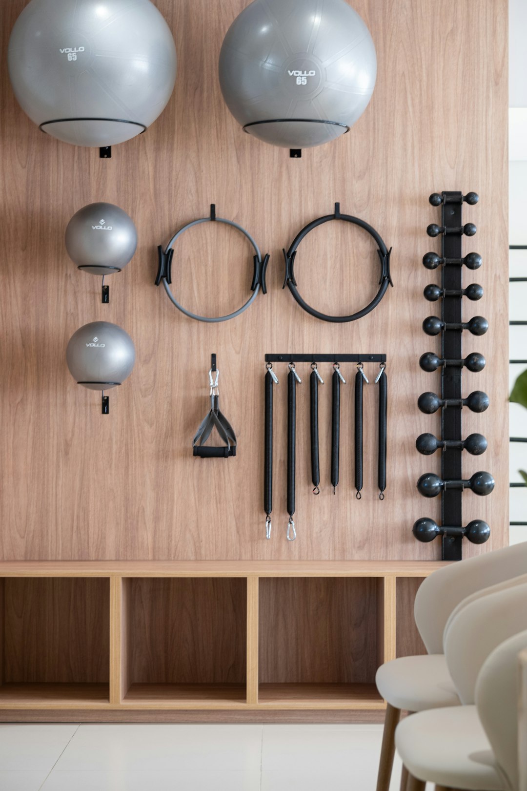 Wellness equipment wall in a PeakSport-fitted studio