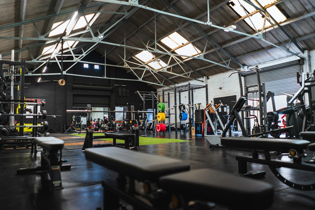 Strength and cardio equipment on a gym floor